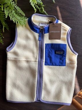 Patagonia Kids Cream Fleece Vest with Blue Pocket and Lavender Trim
